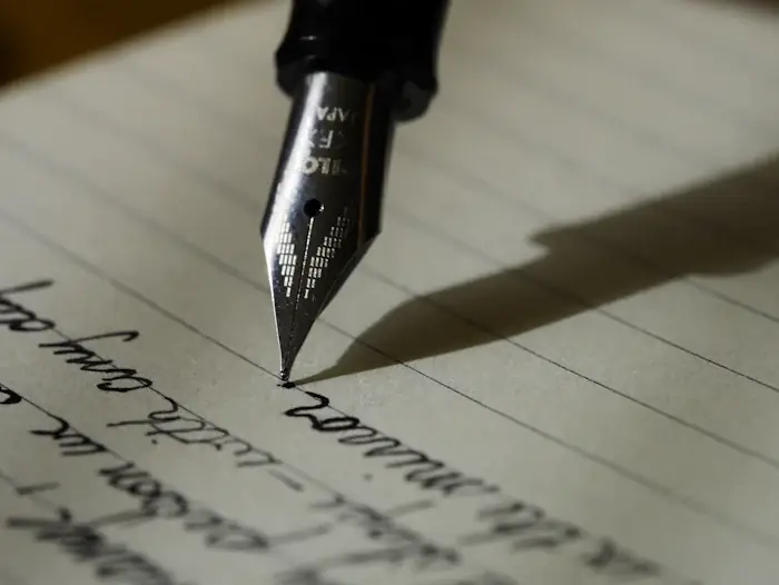 Writer drafting marketing content on paper